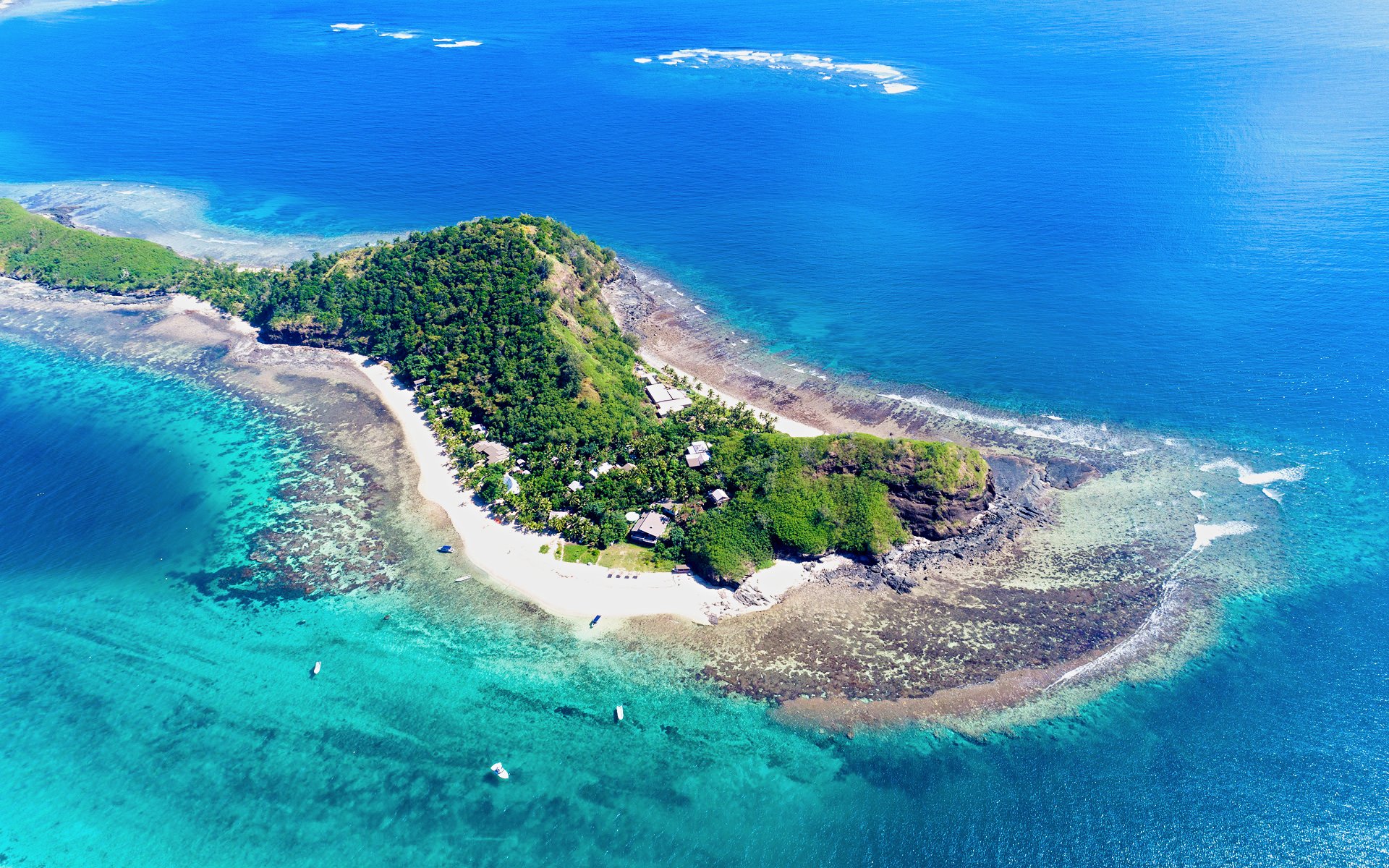 Aerial view of Mantaray Island Resort surrounded by turquoise waters, Fiji.