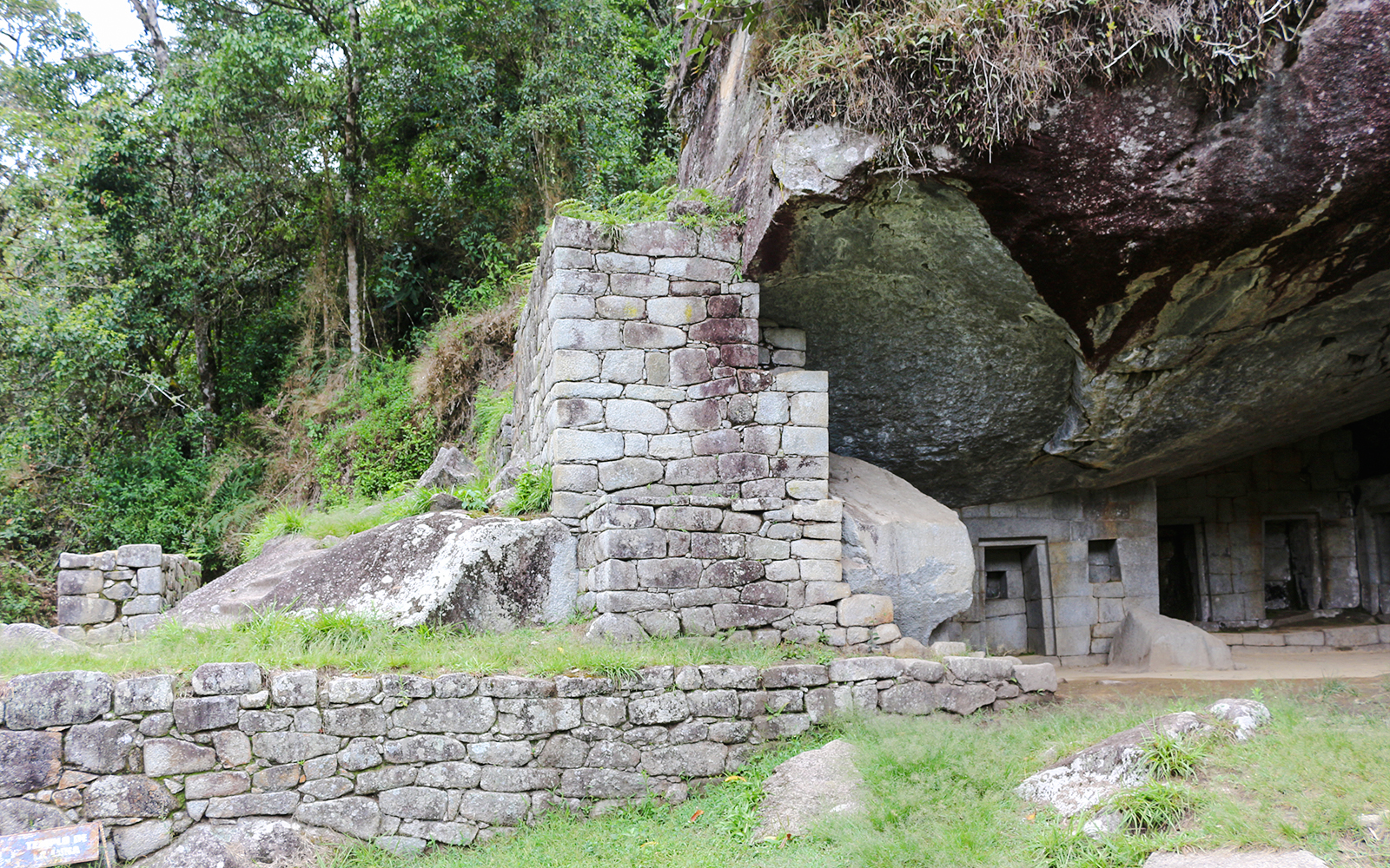 Moon Temple stone structure at Machu Picchu with lush greenery.