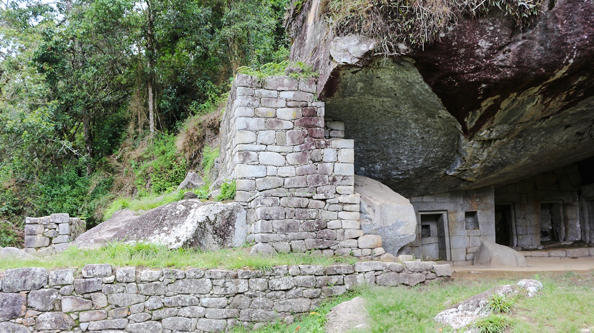 Moon Temple stone structure at Machu Picchu with lush greenery.