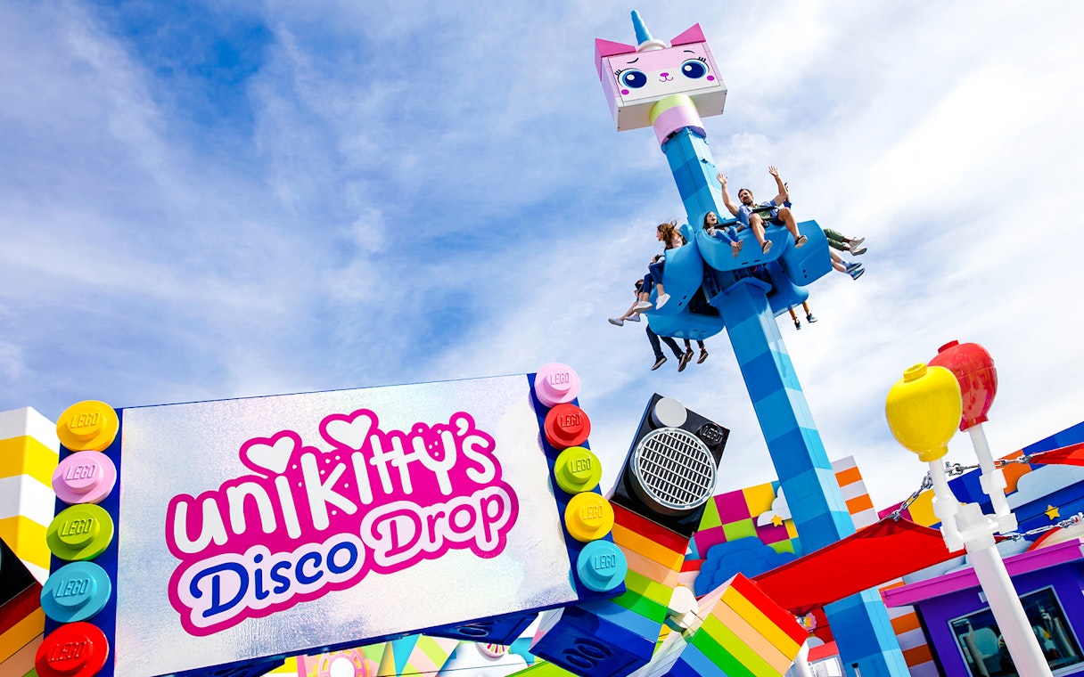Visitors enjoying Unikitty's Disco Drop ride at LEGOLAND® California.