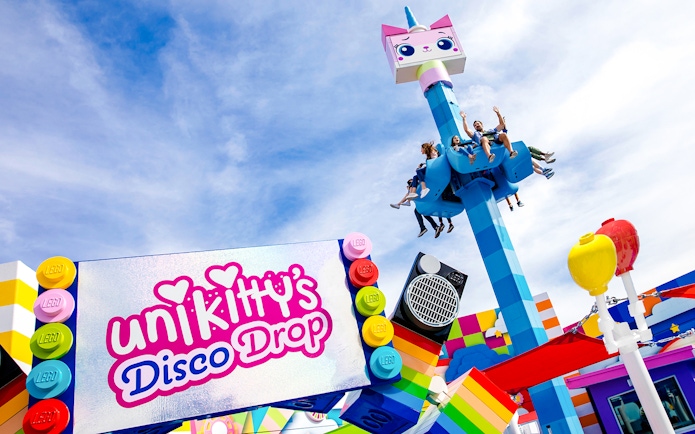 Visitors enjoying Unikitty's Disco Drop ride at LEGOLAND® California.