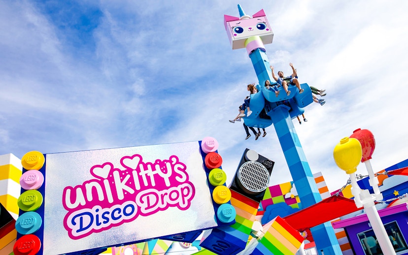 Visitors enjoying Unikitty's Disco Drop ride at LEGOLAND® California.