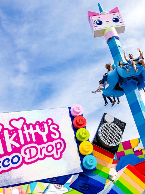 Visitors enjoying Unikitty's Disco Drop ride at LEGOLAND® California.