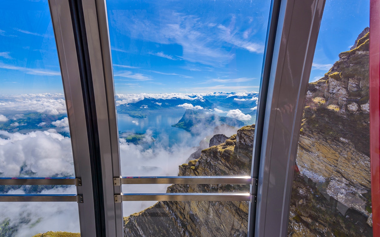 View from cable car to Pilatus Kulm, overlooking Lake Lucerne and surrounding mountains.