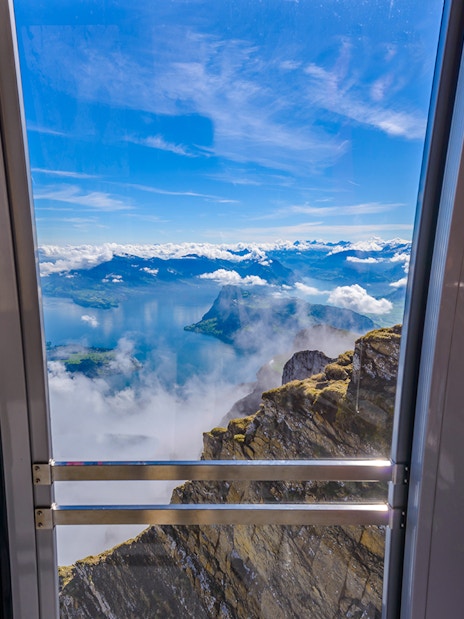 View from cable car to Pilatus Kulm, overlooking Lake Lucerne and surrounding mountains.