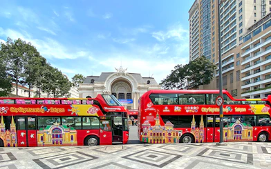 Ho Chi Minh City sightseeing bus in front of the Saigon Opera House.