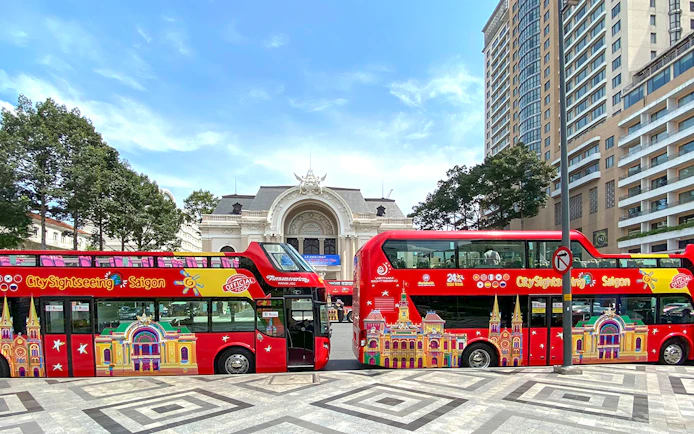 Ho Chi Minh City sightseeing bus in front of the Saigon Opera House.