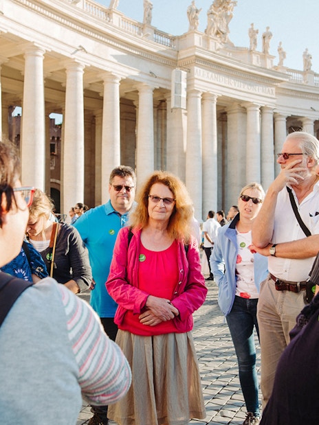 Tour group with guide at St. Peter’s Basilica, Vatican City.