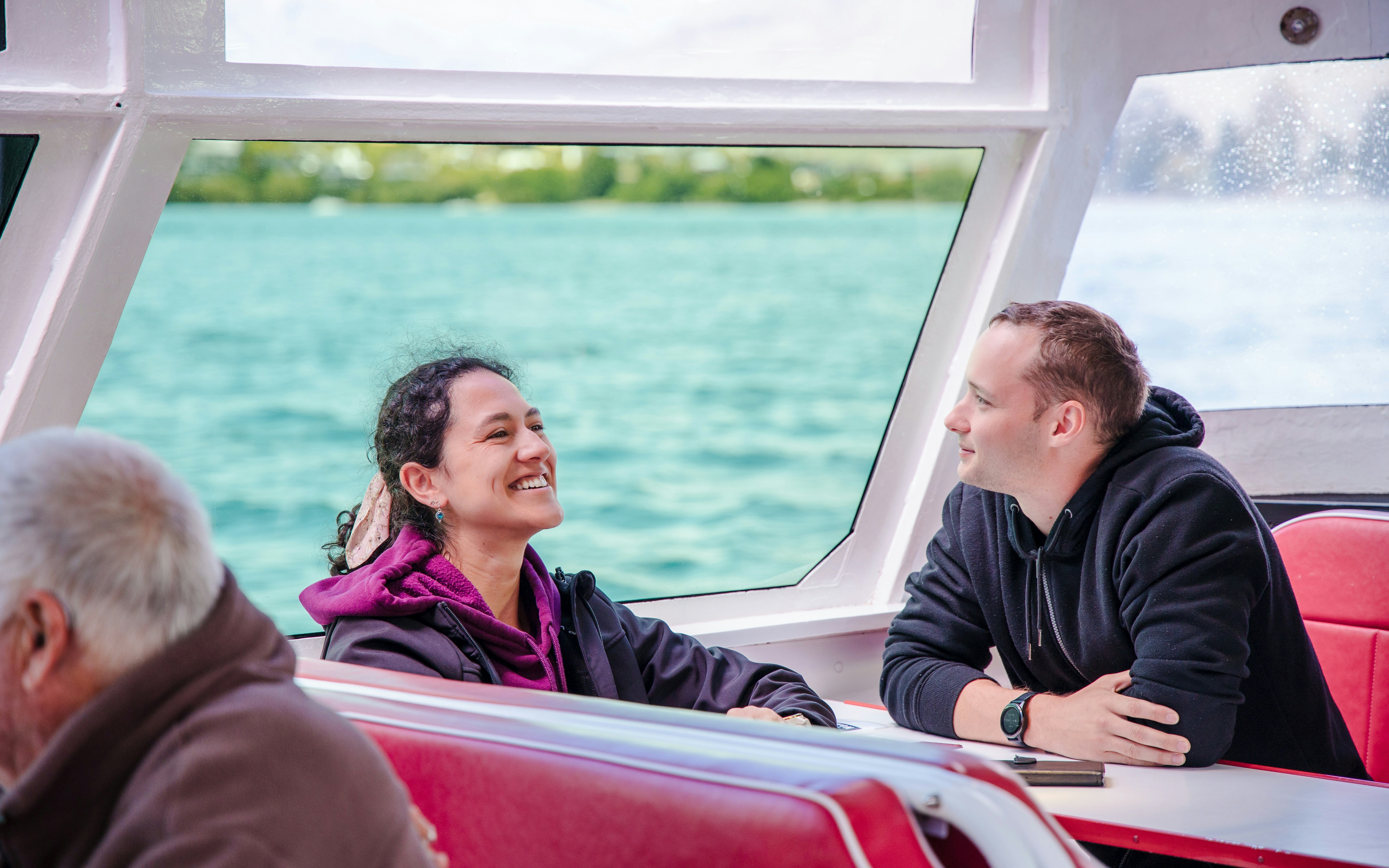 People enjoying a scenic cruise on Lake Wakatipu, Queenstown.