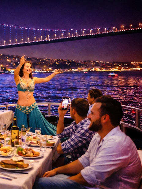 Dinner cruise on the Bosphorus with belly dancer, Istanbul skyline and bridge in background.