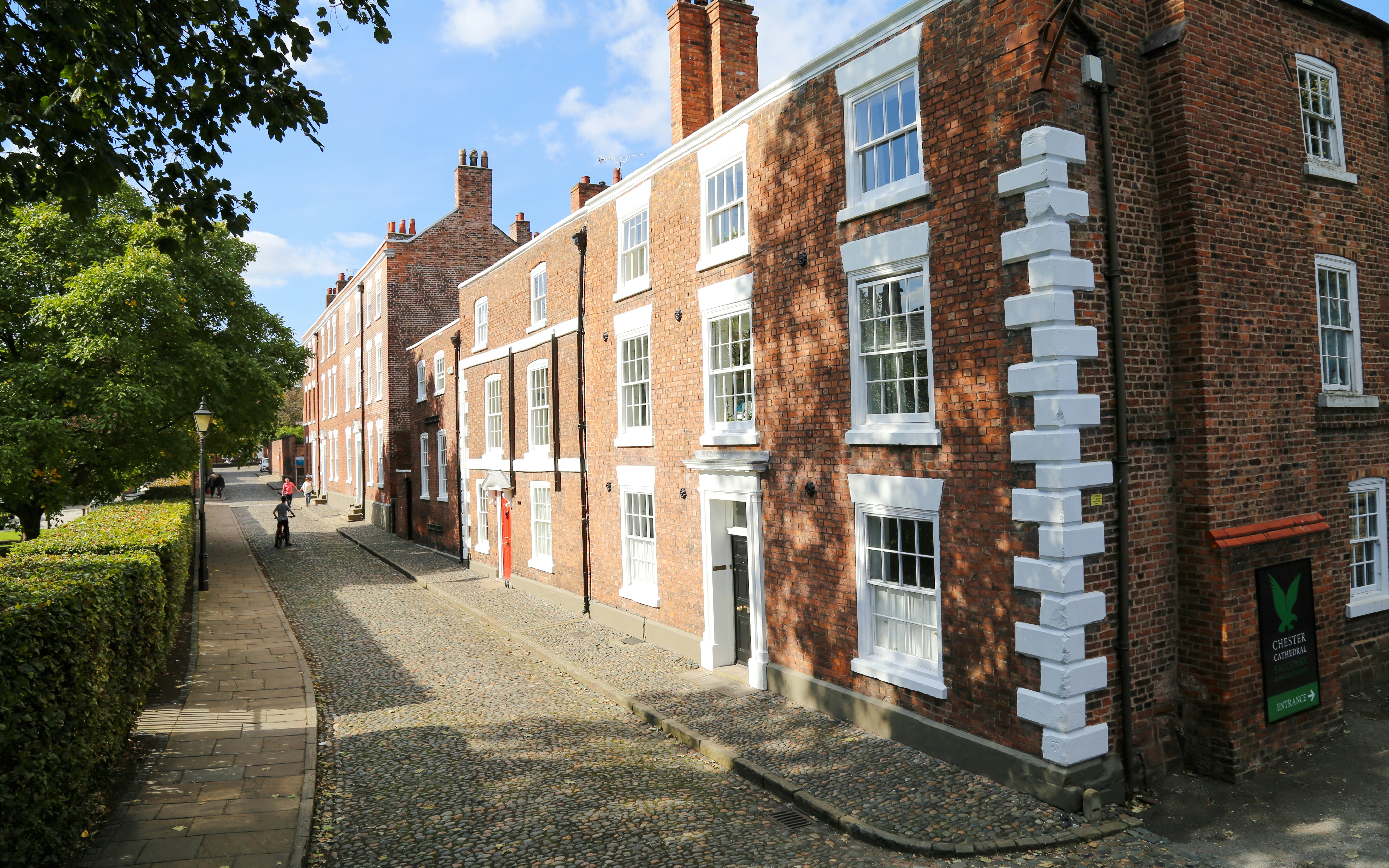 treet of Georgian terraced houses opposite a park in Chester