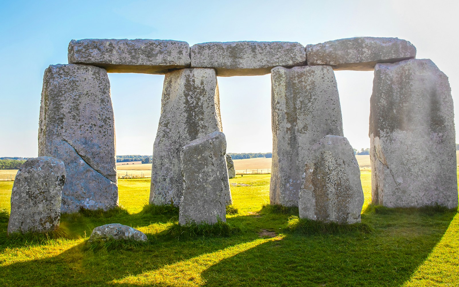Stonehenge stone circle in Salisbury, United Kingdom, under a clear sky.