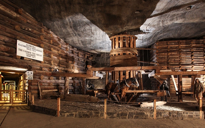 Wieliczka Salt Mine's Casimir the Great Chamber with wooden structures and horse figures.