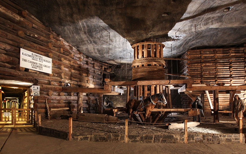 Wieliczka Salt Mine's Casimir the Great Chamber with wooden structures and horse figures.