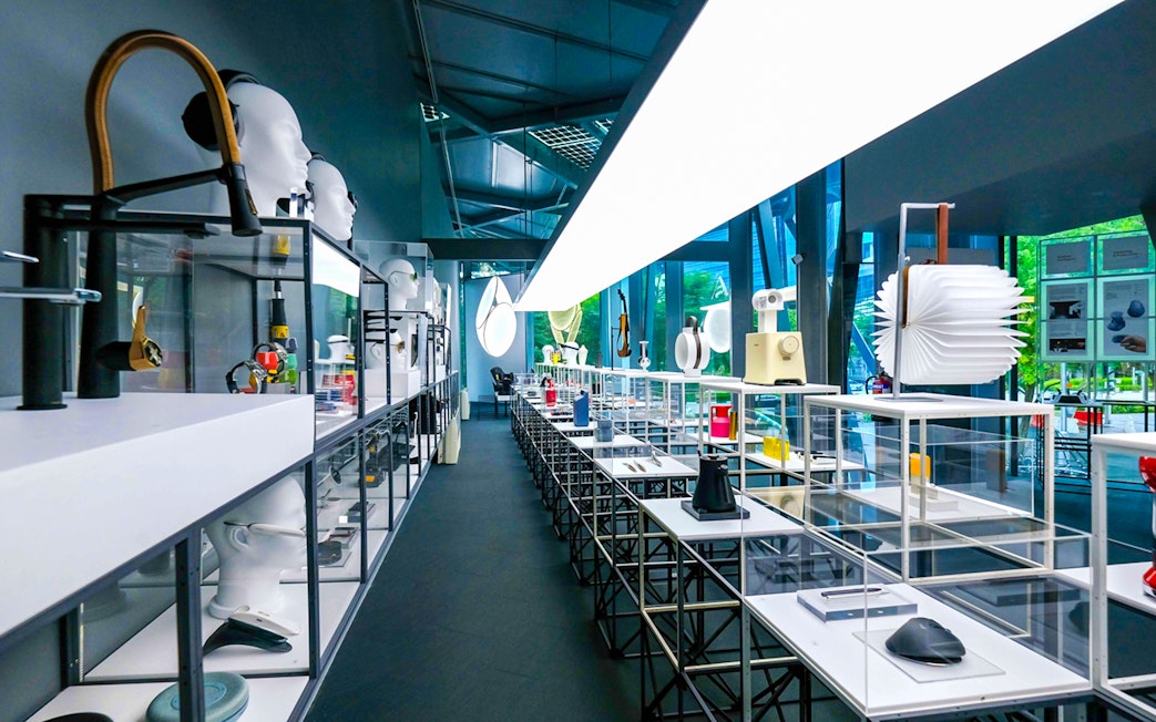 Exhibit displays at Red Dot Design Museum Singapore with modern design objects.