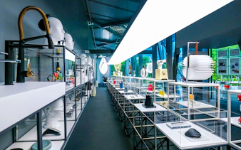 Exhibit displays at Red Dot Design Museum Singapore with modern design objects.