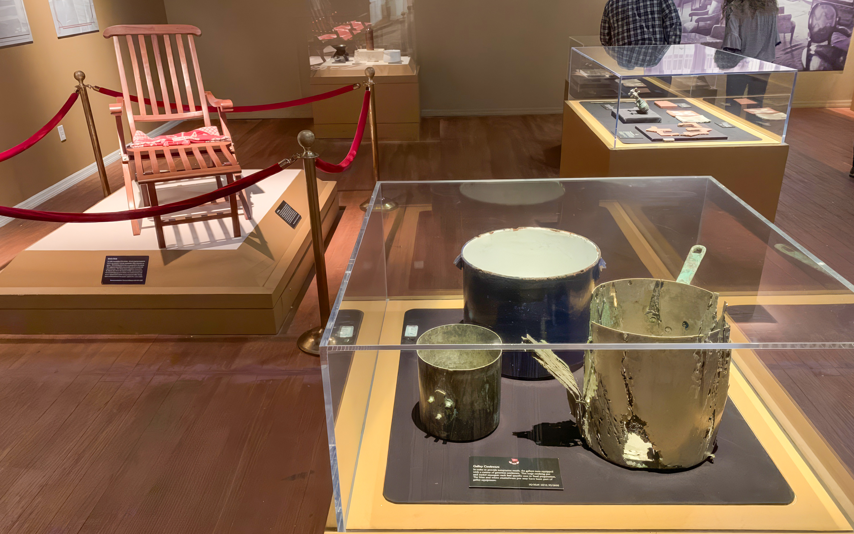 Artifacts from Titanic: The Artifact Exhibition, including a deck chair and cooking pots.