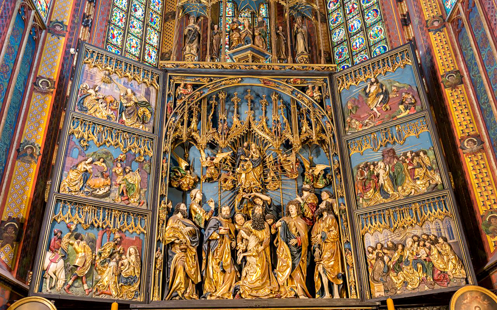 St. Mary's Basilica altar with intricate religious carvings, Krakow Old Town tour.