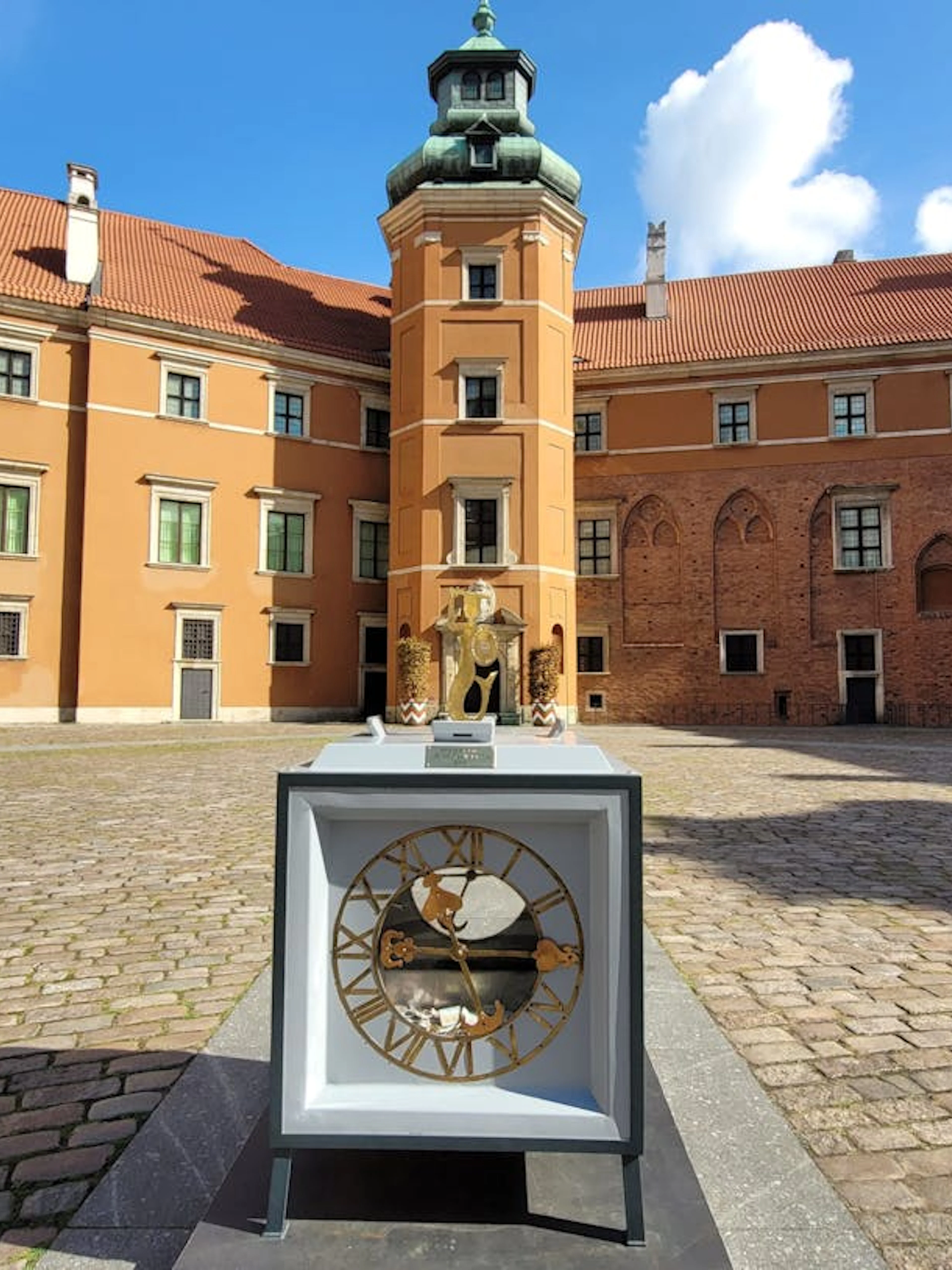 Royal Castle Warsaw courtyard with historic clock display.