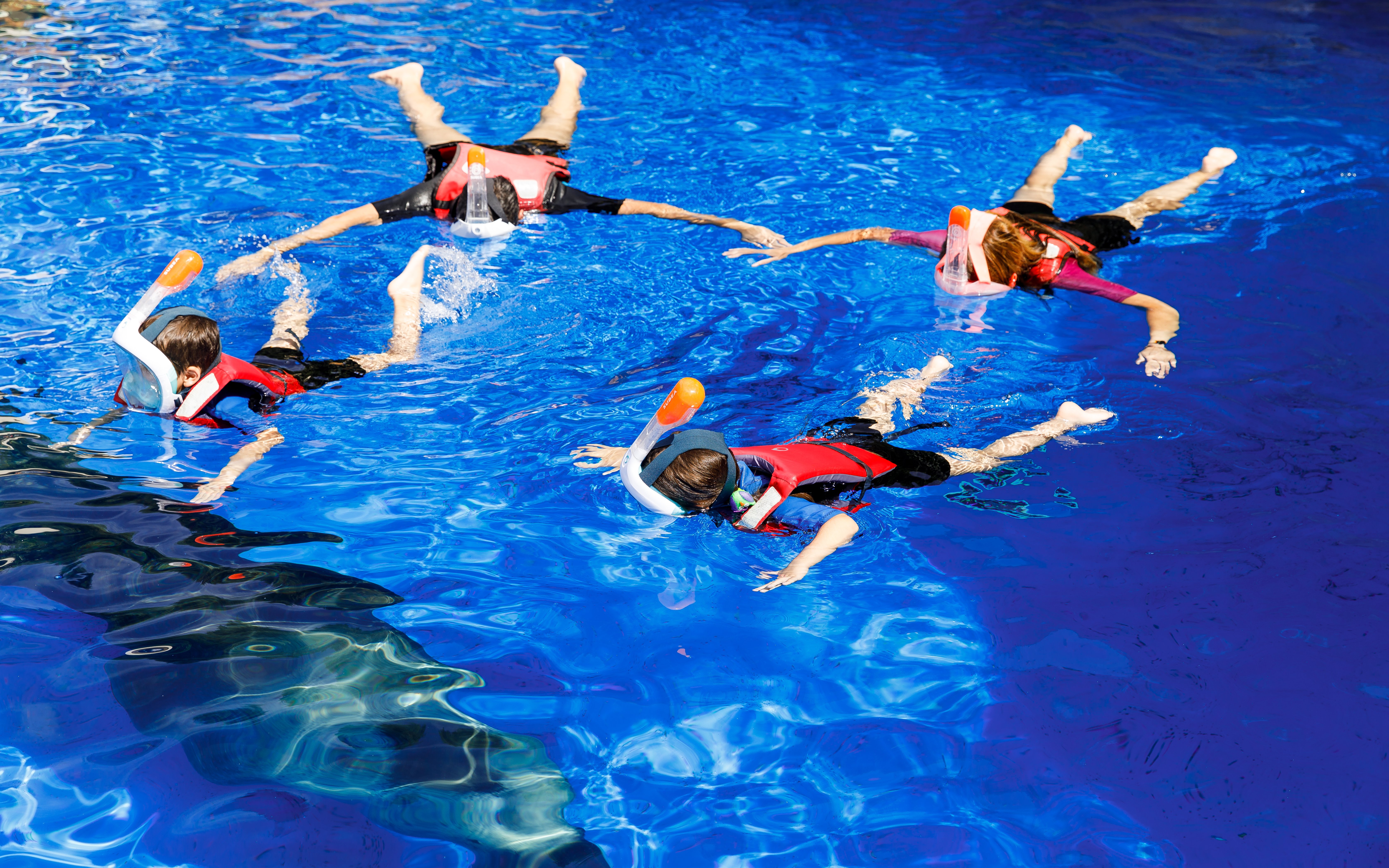 Kids snorkeling in a pool at Selwo Marina, Spain.