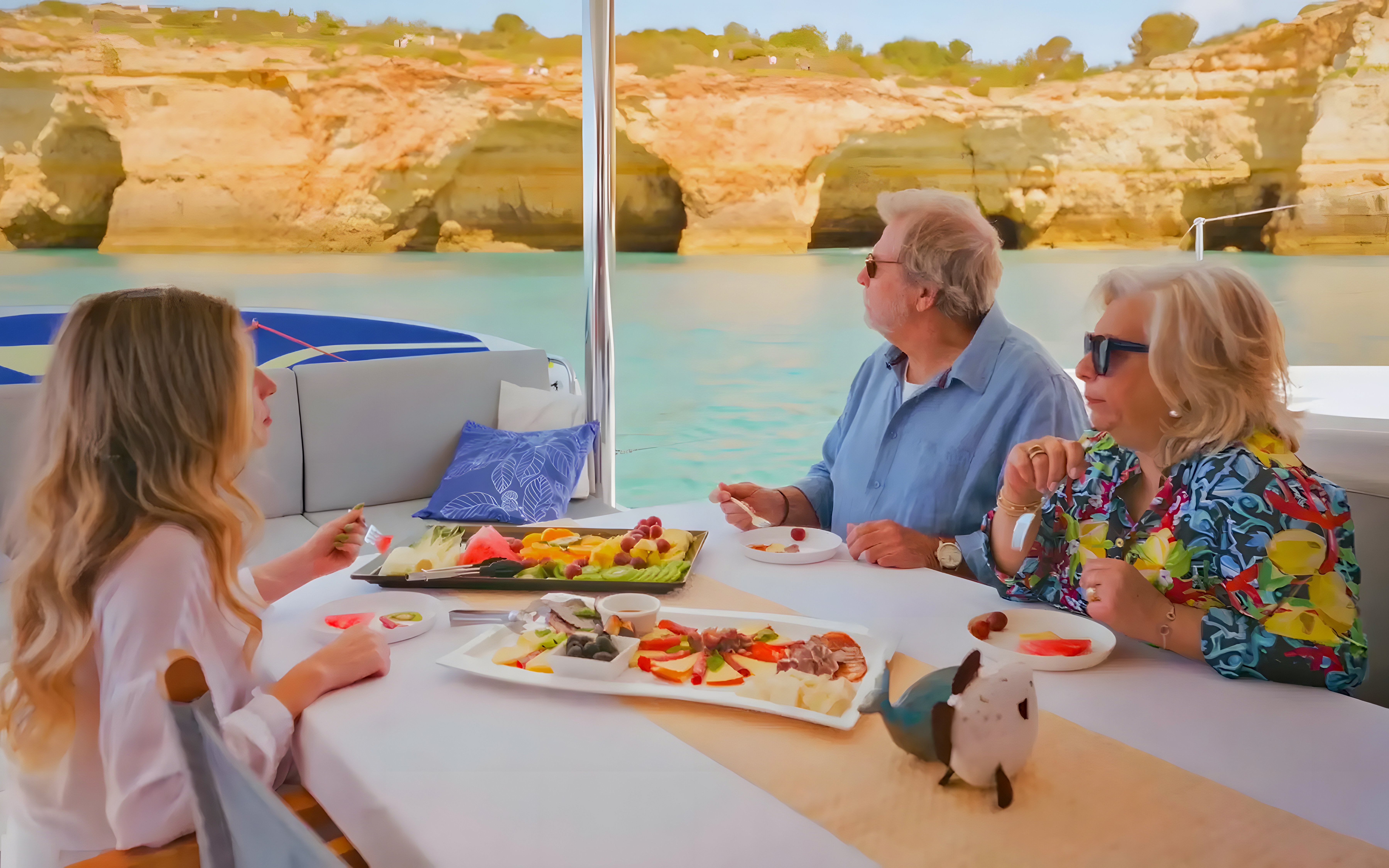 Brunch and drinks on a boat with view of Benagil Caves, Algarve coast.