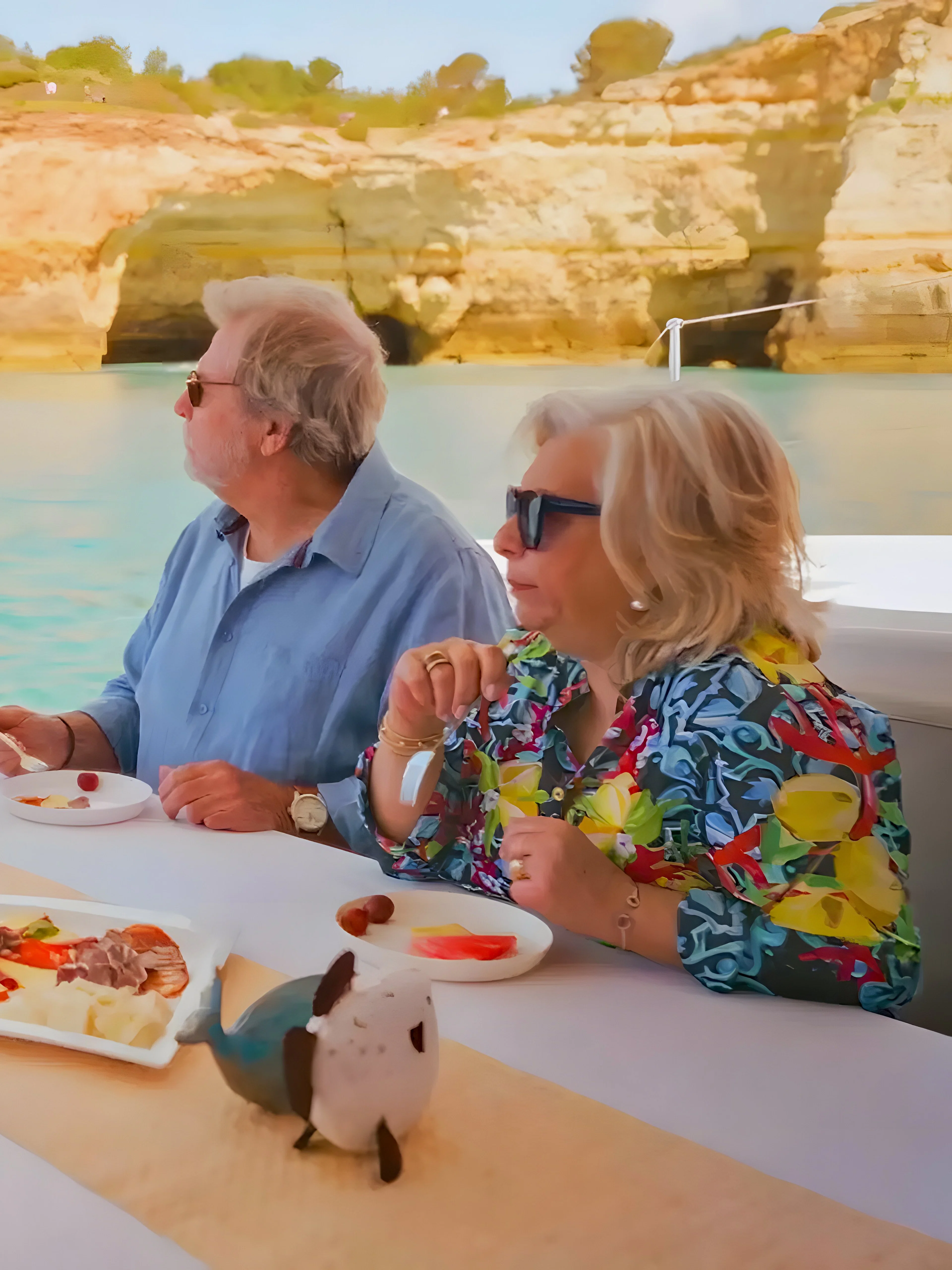 Brunch and drinks on a boat with view of Benagil Caves, Algarve coast.
