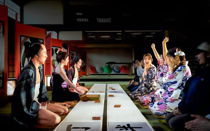 Visitors enjoying a traditional performance at TOEI Kyoto Studio Park.