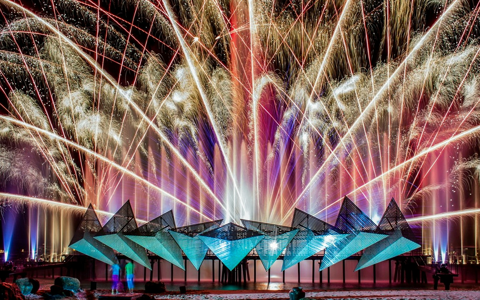 Fireworks display at Wings of Time exhibition, Sentosa Island, at night.
