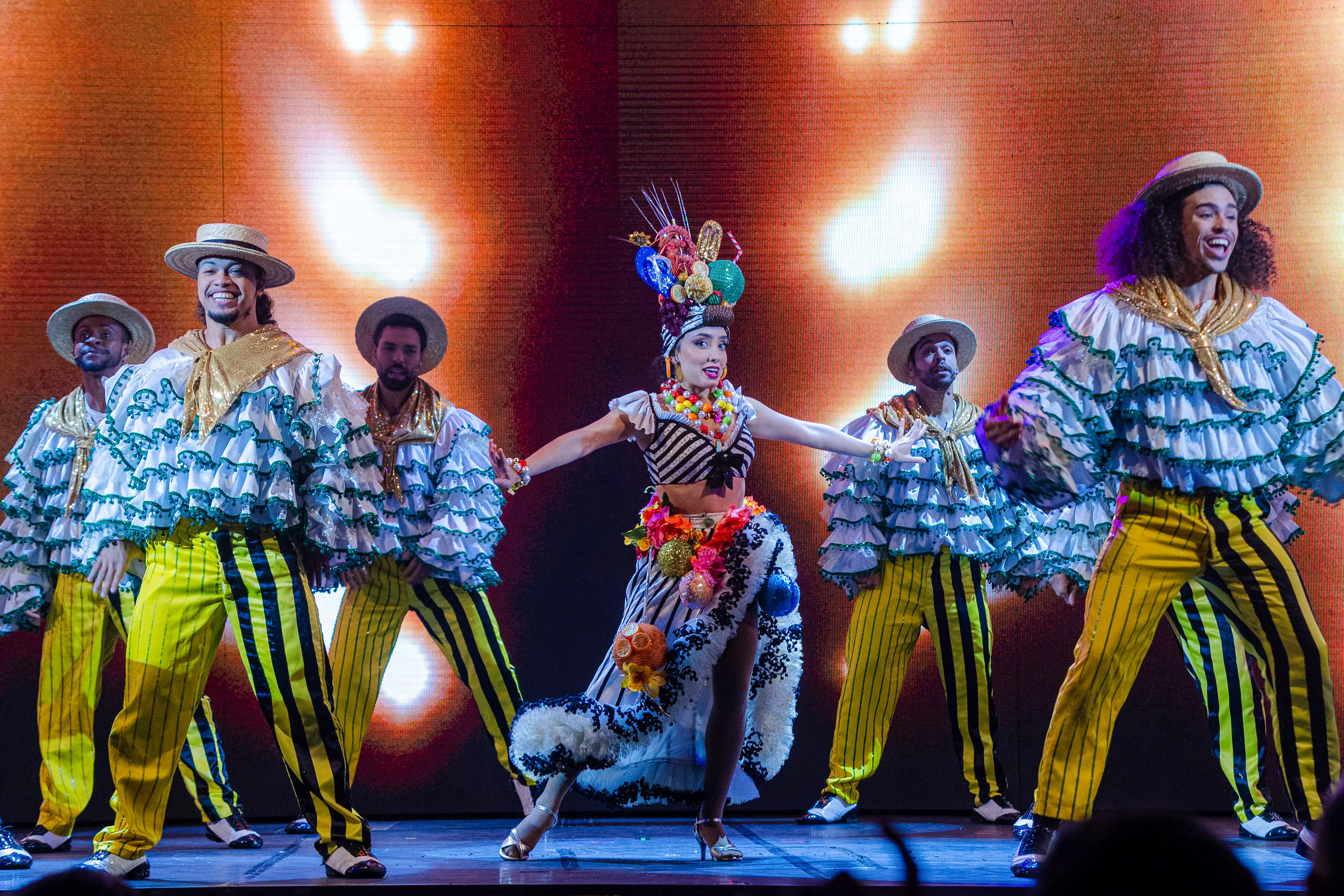 Performers in vibrant costumes dancing at Roxy Dinner Show, Rio de Janeiro.