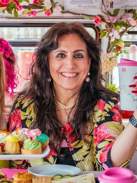 Guests enjoying pastries and drinks on the Classic Afternoon Tea Bus Tour.