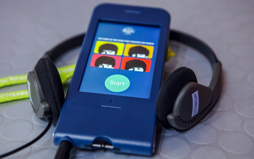 Audio guide device for The Beatles Story tour with headphones.
