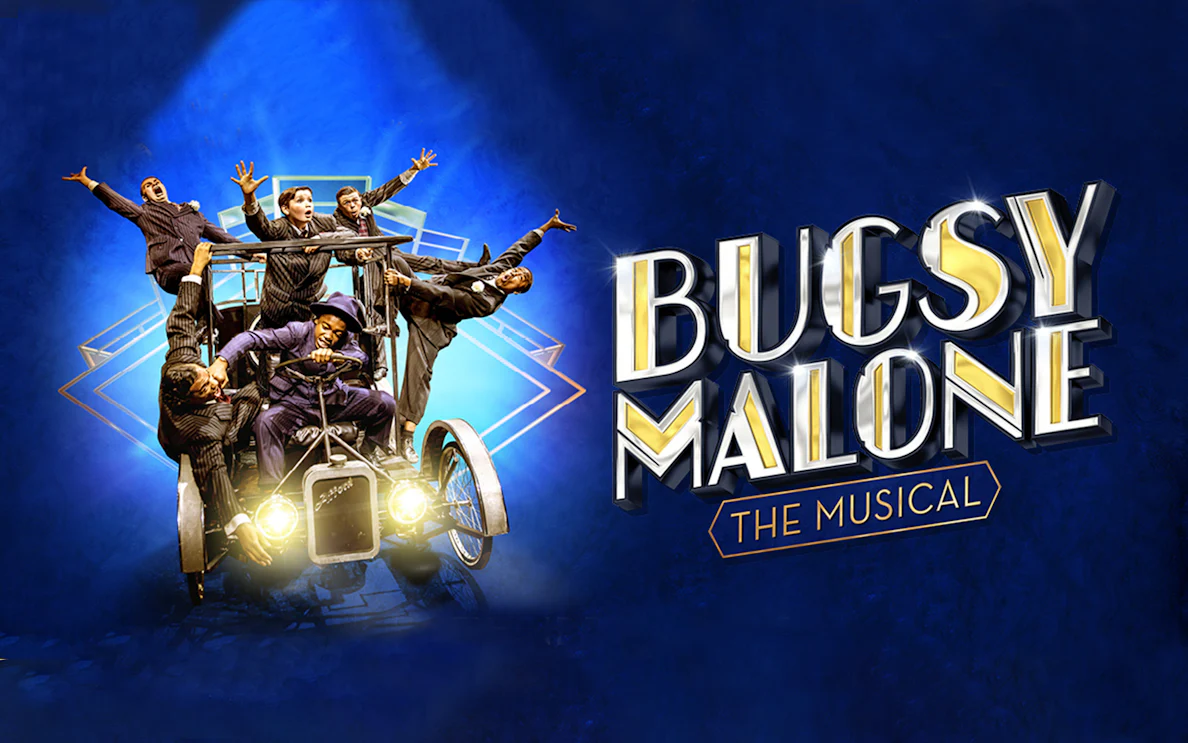 Cast of Bugsy Malone musical on vintage car against blue background