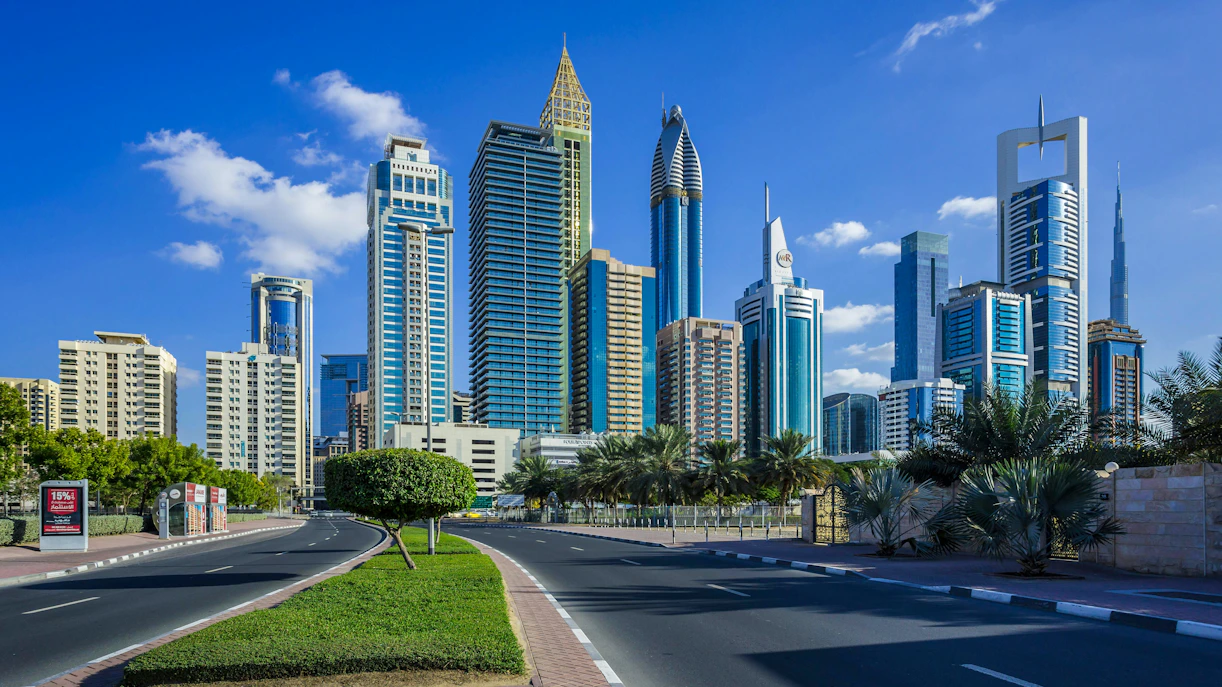 Skyscrapers in Dubai's financial center with clear blue sky.