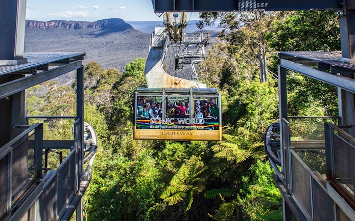 Cableway ride at Scenic World, Blue Mountains with passengers and forest view.