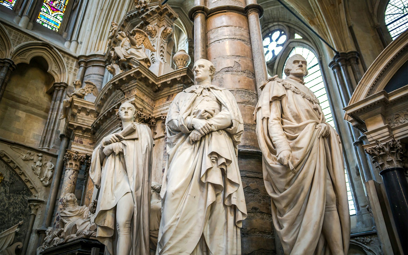 Statues inside Westminster Abbey, London, showcasing historical figures.