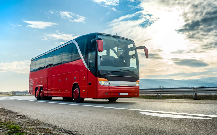 Red tour bus on highway en route to Krka National Park from Zadar.