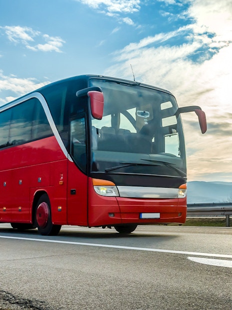 Red tour bus on highway en route to Krka National Park from Zadar.