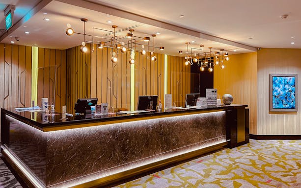 Reception desk at Ambassador Transit Lounge, Terminal 3, Changi Airport.