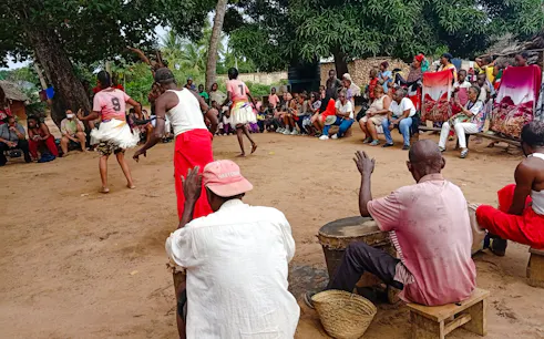 Giriama dancers performing with drummers in a local village, Diani Beach.
