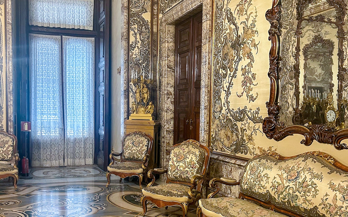Gasparini's Hall interior with ornate furniture and detailed wall designs, Royal Palace Madrid.