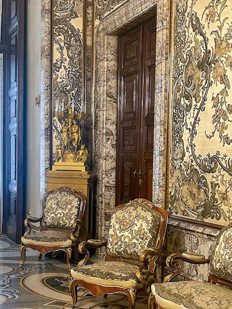 Gasparini's Hall interior with ornate furniture and detailed wall designs, Royal Palace Madrid.