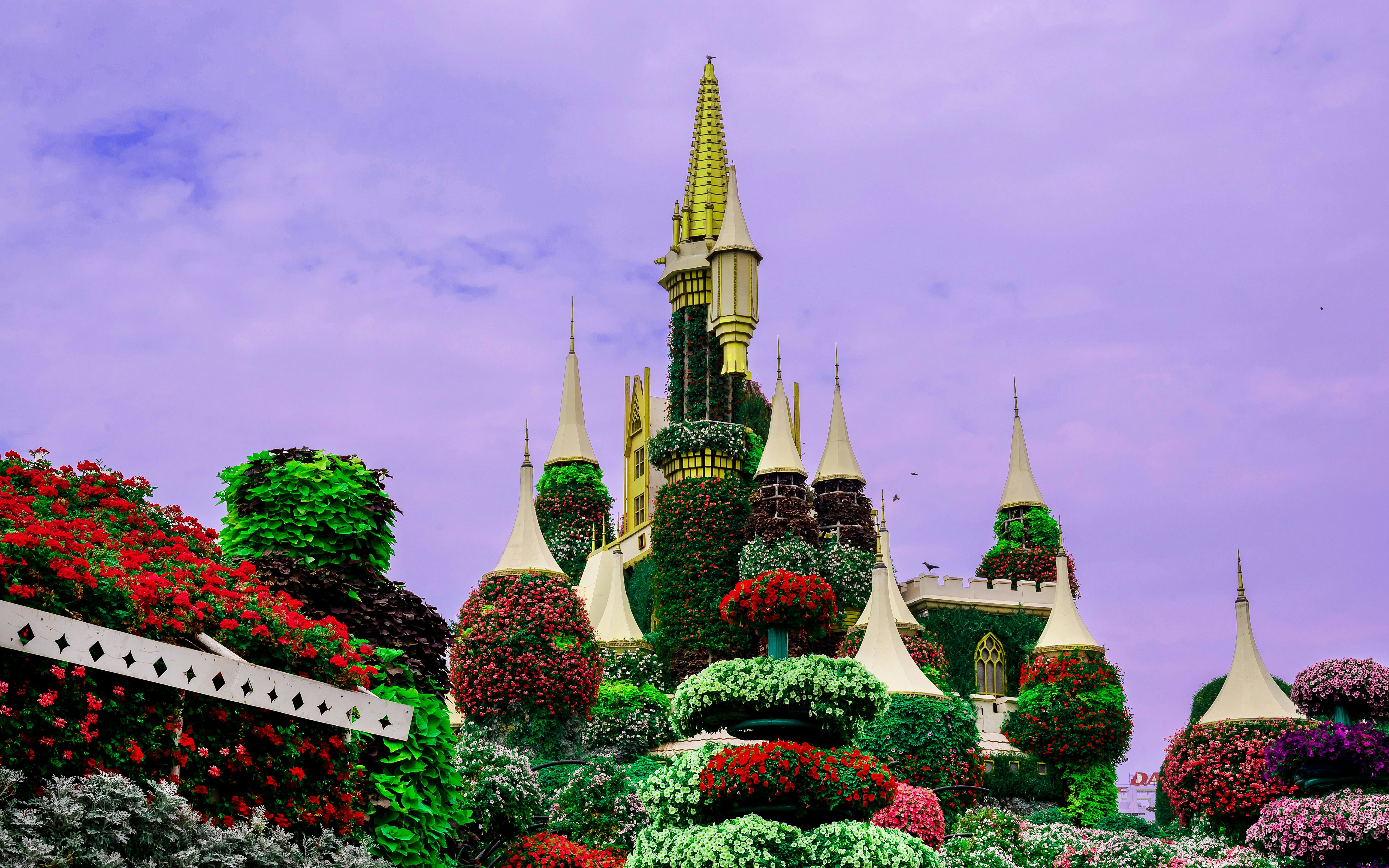 Floral castle covered in vibrant flowers at Miracle Garden, Dubai.
