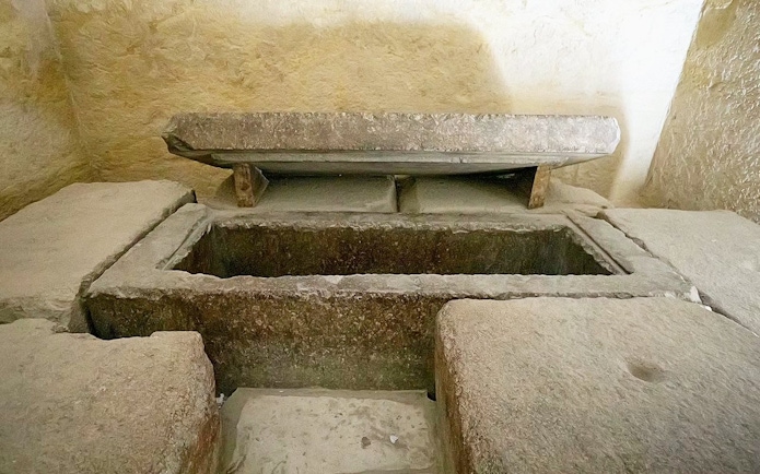 Burial chamber with stone sarcophagus inside Pyramid of Khafre, Giza, Cairo day trip from Hurghada.