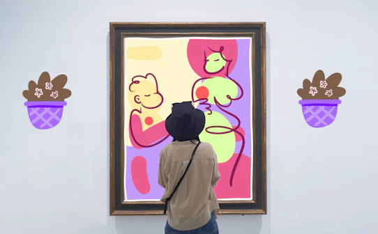Visitor admiring abstract art in a gallery, ideal for art and culture enthusiasts.