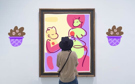 Visitor admiring abstract art in a gallery, ideal for art and culture enthusiasts.