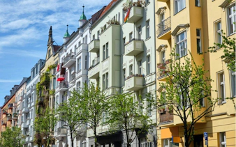 Colorful historic buildings in Berlin's Jewish District, part of a self-guided city exploration game.