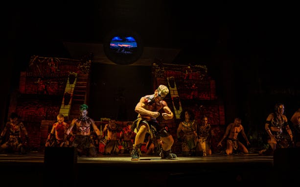 Performers in traditional costumes on stage during "MALINCHE, un musical de Nacho Cano.