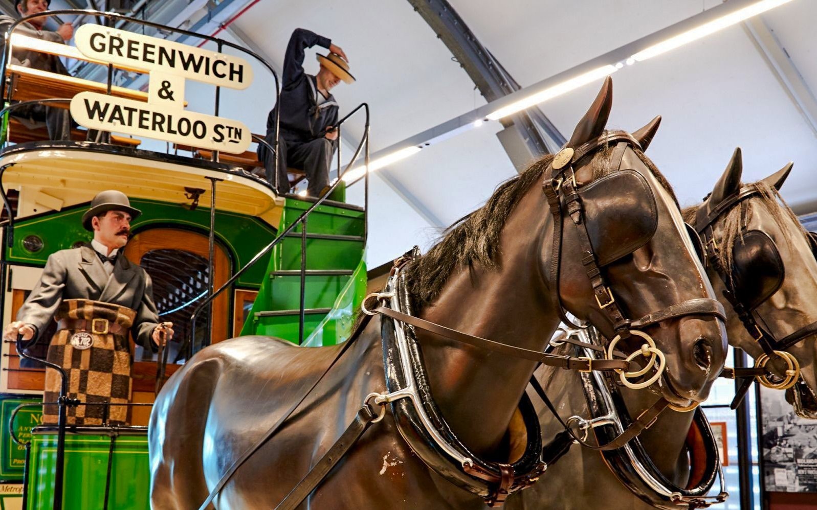 Horse-drawn tram exhibit at London Transport Museum with Greenwich & Waterloo sign.