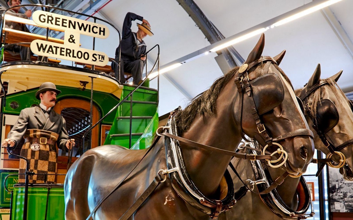 Horse-drawn tram exhibit at London Transport Museum with Greenwich & Waterloo sign.