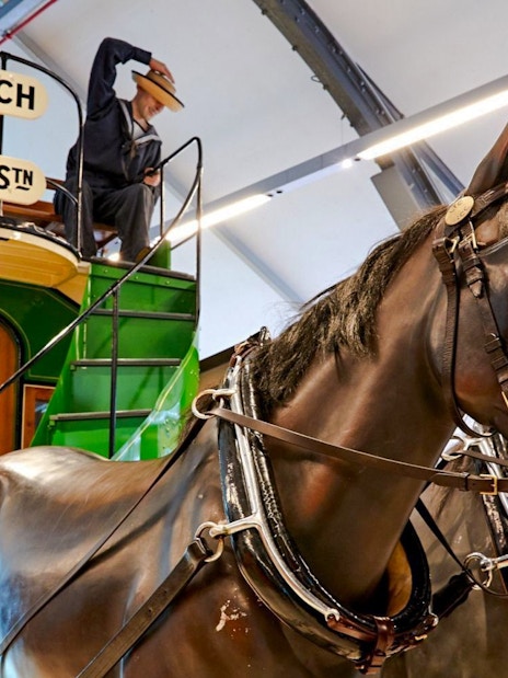 Horse-drawn tram exhibit at London Transport Museum with Greenwich & Waterloo sign.